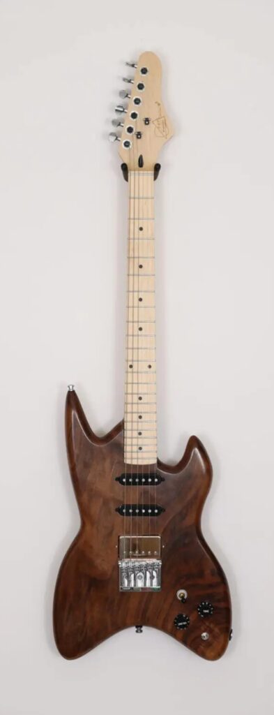 A brown-colored molar walnut electric guitar